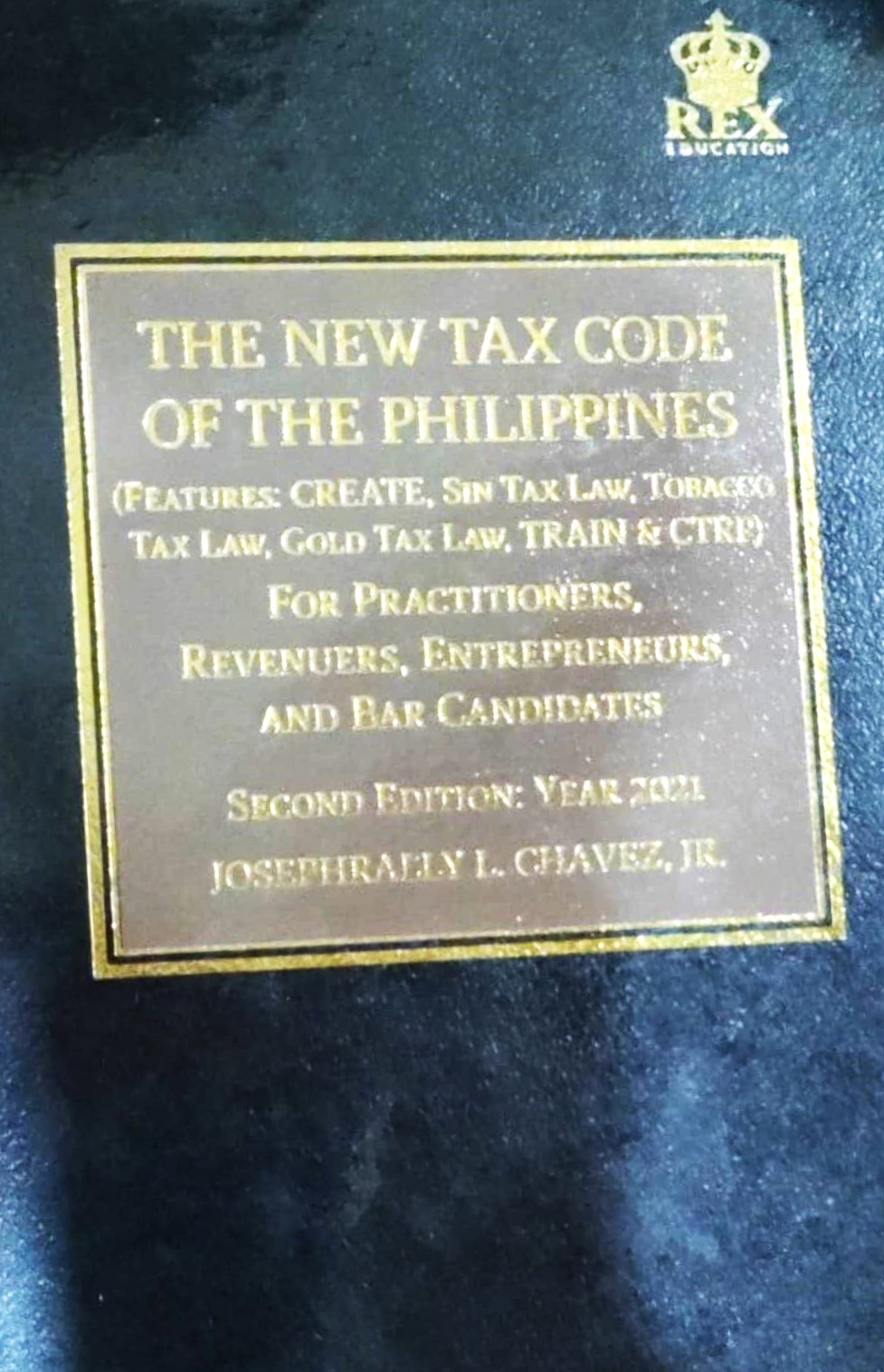 Book cover: The New tax code of the Philippines (features: CREATE sin tax law, tobacco tax law gold tax law, train & CTRP): for practitioners, revenuers, entrepreneurs, and bar candidates.